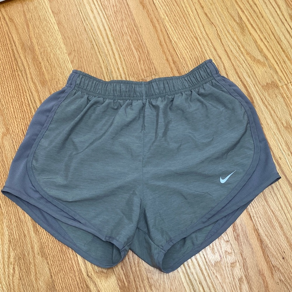 Nike dri fit shorts. Has built in shorts underneath. Worn only a few times.